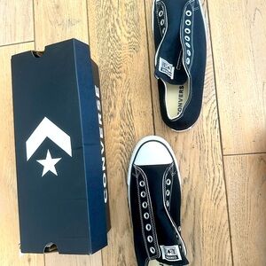 Brand new in the box very rare slip on style converse in black.